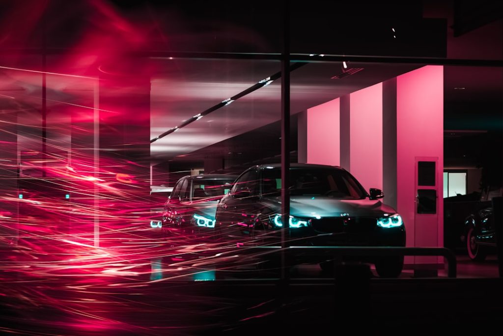 photography-of-two-cars-inside-building-omyghpwgeu
